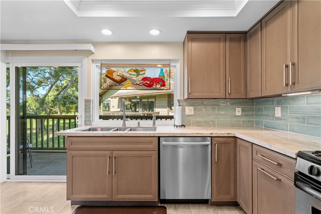 Kitchen towards sliding door to deck off Kitchen - 30 Arboles 34, Irvine CA 92612 - photo 17