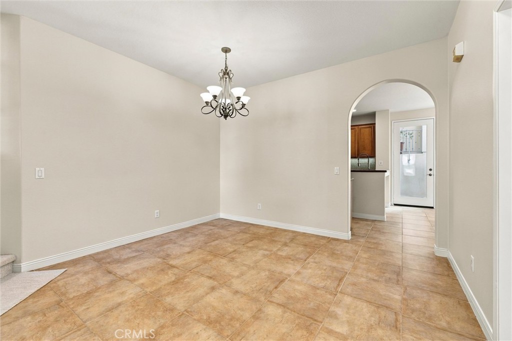 Living room opens to kitchen - 301 Tall Oak, Irvine CA 92603 - photo 6