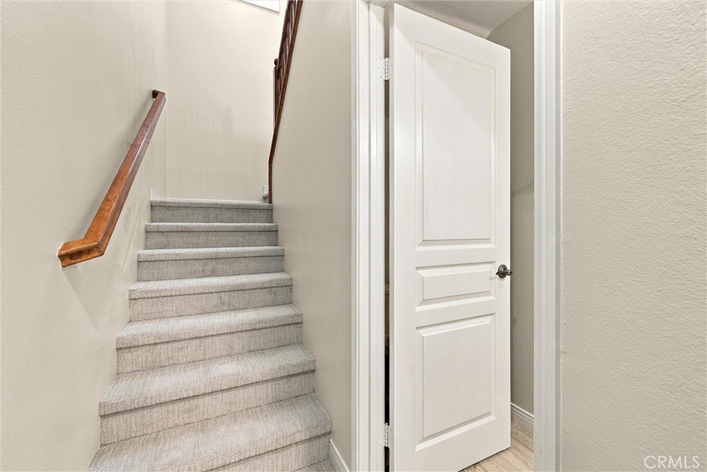 stairs to go upstairs with brand new carpeting - 301 Tall Oak, Irvine CA 92603 - photo 10