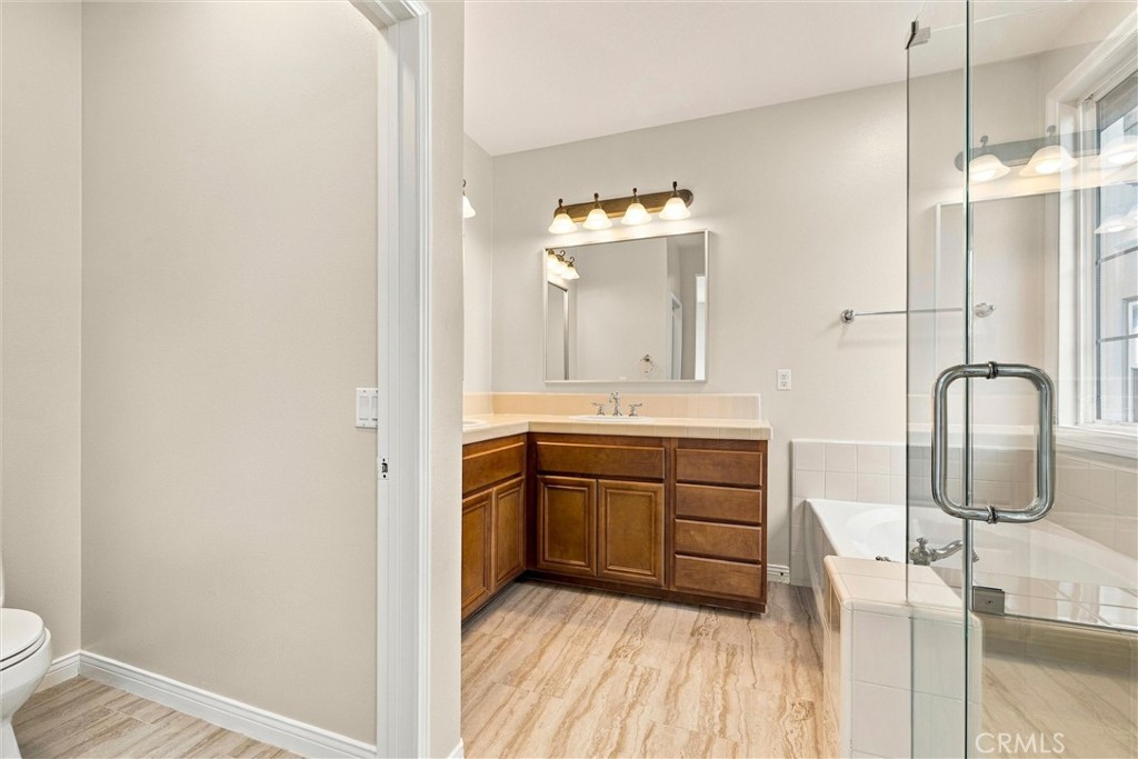 Master bathroom with tub and walk-in shower - 301 Tall Oak, Irvine CA 92603 - photo 29