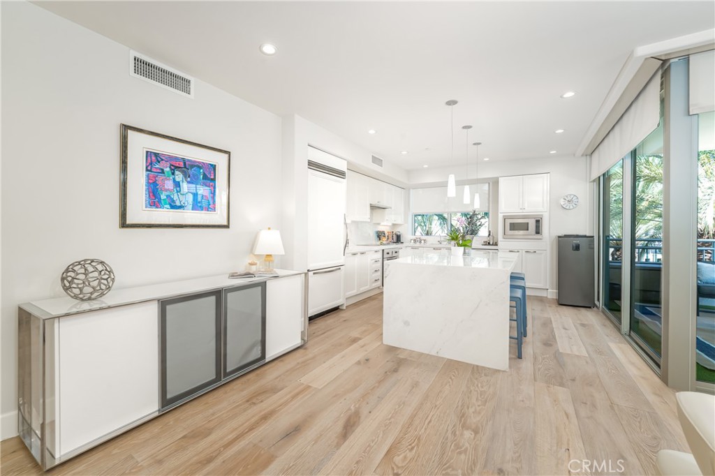 Remodeled kitchen with stone counters over gloss white lacquer Snaidero cabinetry. Sub-Zero refirgerator and Viking appl - 3043 Scholarship, Irvine CA 92612 - photo 9