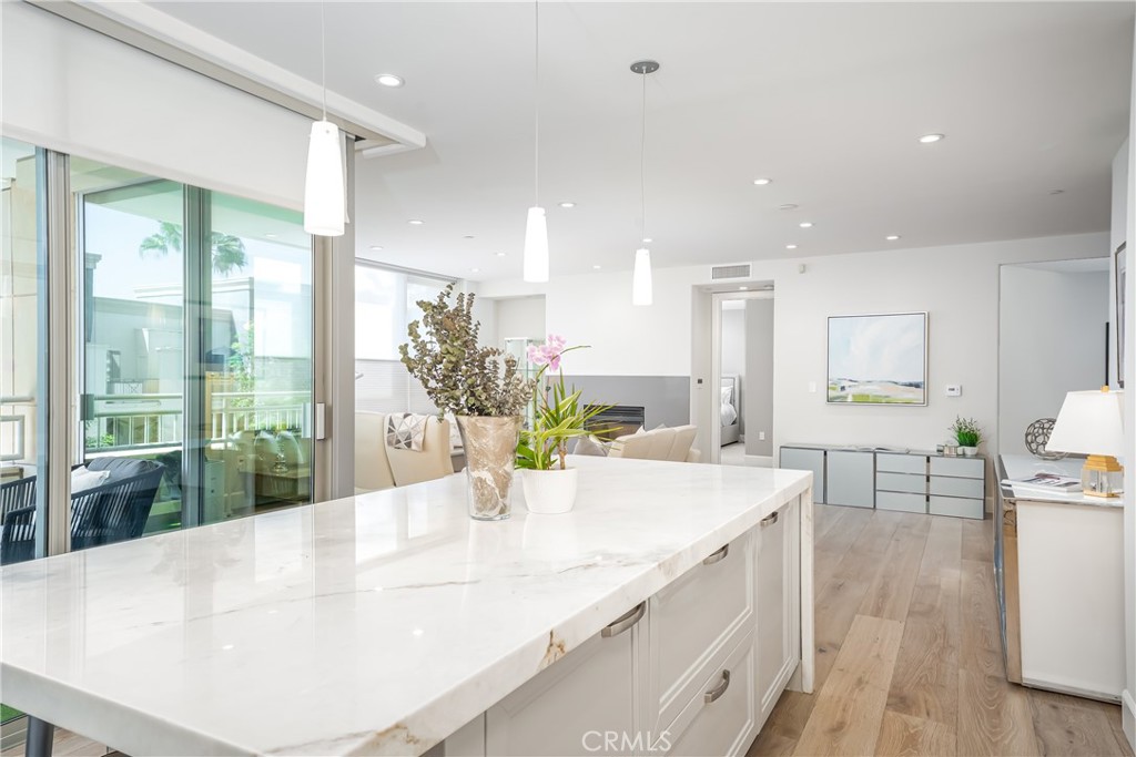 Remodeled kitchen with stone counters over gloss white lacquer Snaidero cabinetry. Sub-Zero refirgerator and Viking appl - 3043 Scholarship, Irvine CA 92612 - photo 14