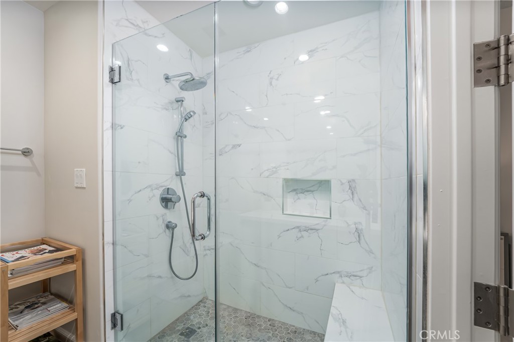 Second suite remodeled walk-in shower with bench and frameless glass enclosure - 3043 Scholarship, Irvine CA 92612 - photo 27
