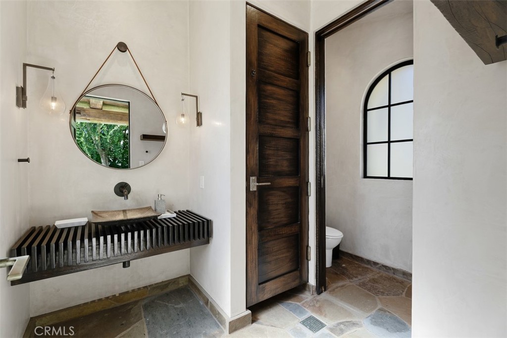 Outdoor half bathroom with laundry and outdoor shower. - 31 Blue Heron, Irvine CA 92603 - photo 53
