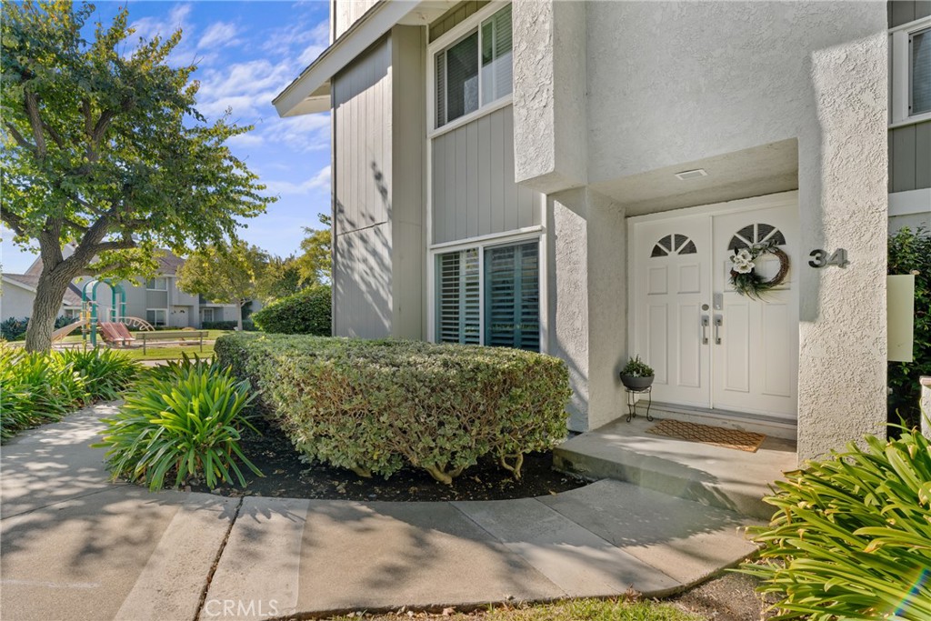 Front Entrance Exterior on premium corner lot - 34 Mirror Lake 53, Irvine CA 92604 - photo 1