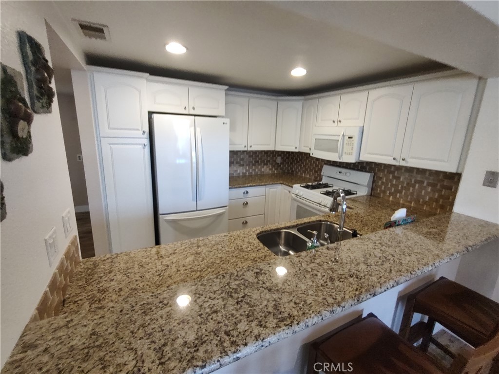 Kitchen with Bar Seating - 36 Woodleaf, Irvine CA 92614 - photo 8