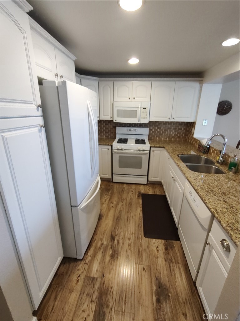Kitchen with granite countertops and abundance of storage - 36 Woodleaf, Irvine CA 92614 - photo 9