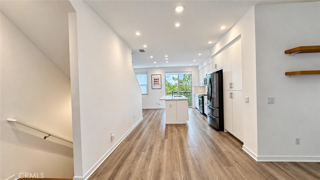View of kitchen and island - 369 Placemark, Irvine CA 92614 - photo 9