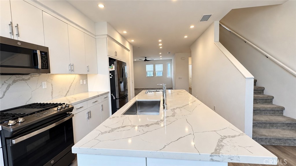 Open kitchen with large island - 369 Placemark, Irvine CA 92614 - photo 12