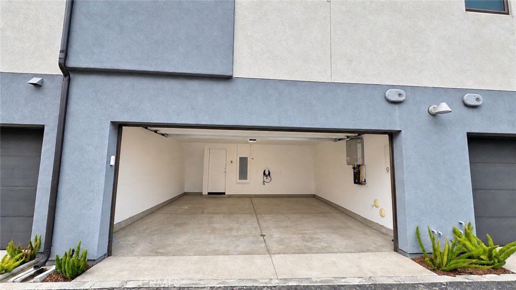 Garage with Tesla charger - 369 Placemark, Irvine CA 92614 - photo 24