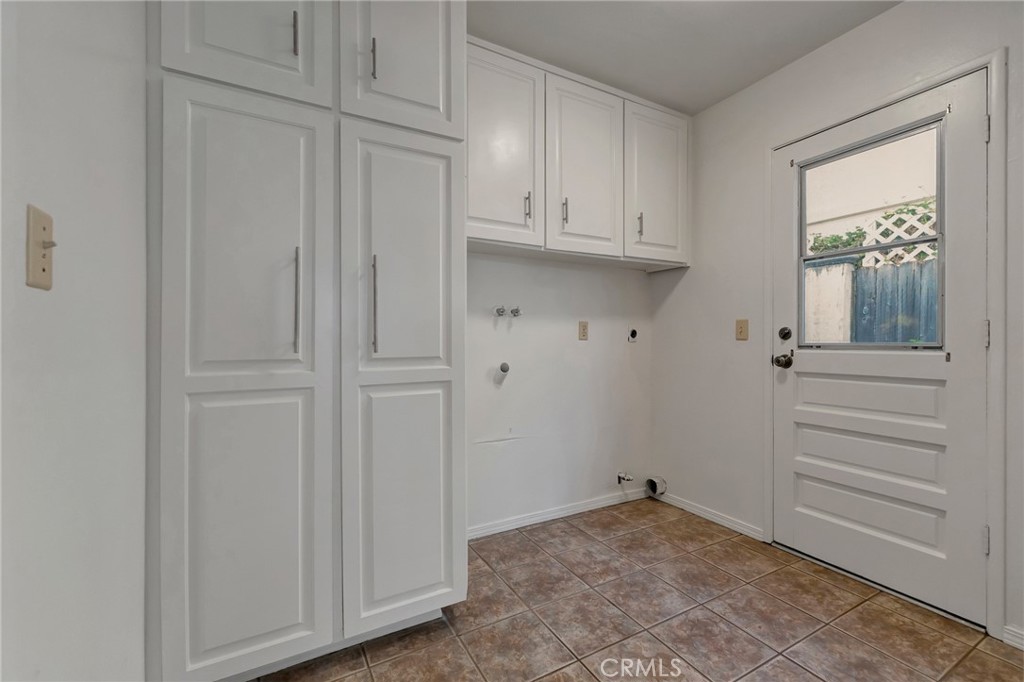 laundry area which leads to outside, 1/2 bath and family area - 3812 Salem, Irvine CA 92614 - photo 15