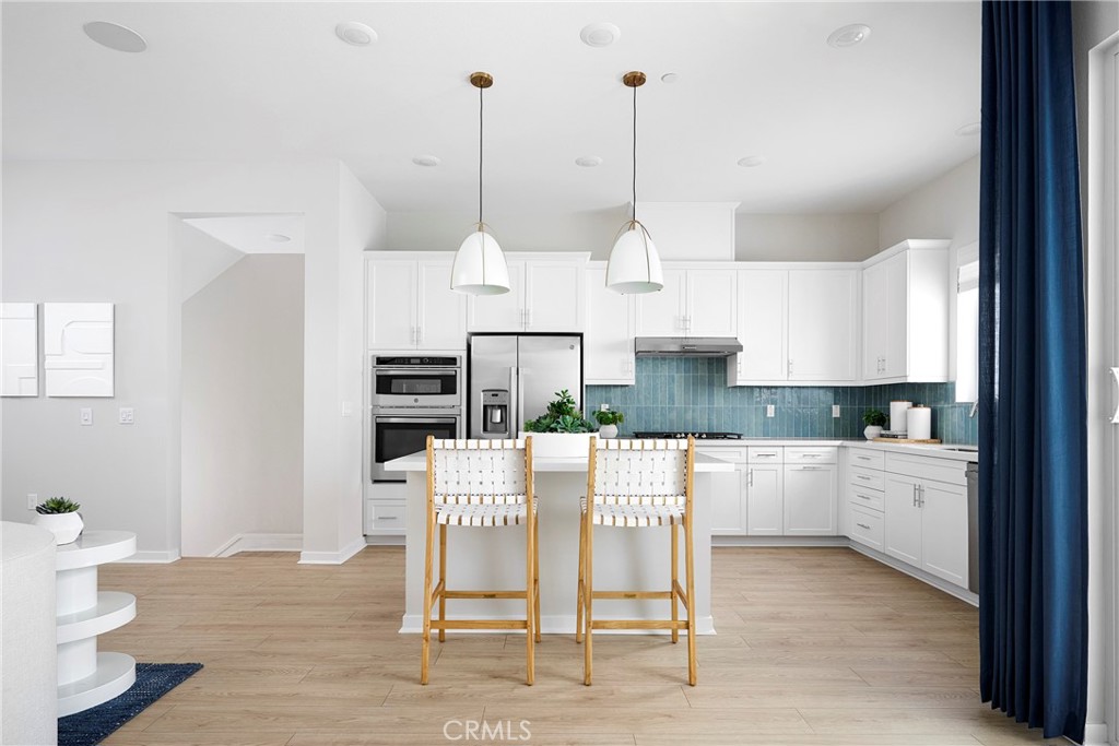 Model Photos: Photos shown are of the model home for this floor plan. Actual finishes, features, and landscaping may var - 467 Treble, Irvine CA 92618 - photo 5