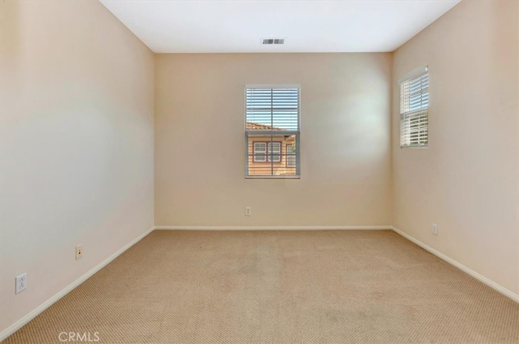 Guest room end of hall - light and bright! Has own walk-in closet with organizers - 47 Canopy, Irvine CA 92603 - photo 25