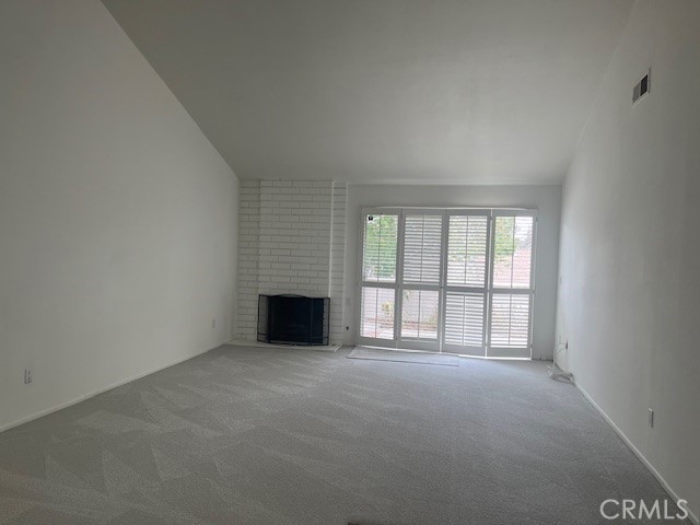 Combo living/dining with access to rear patio - 5 Cashew, Irvine CA 92612 - photo 6