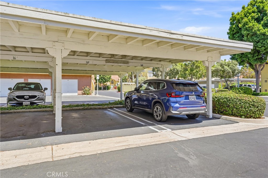 The covered parking space for this home - 51 Abrazo Aisle 169, Irvine CA 92614 - photo 26