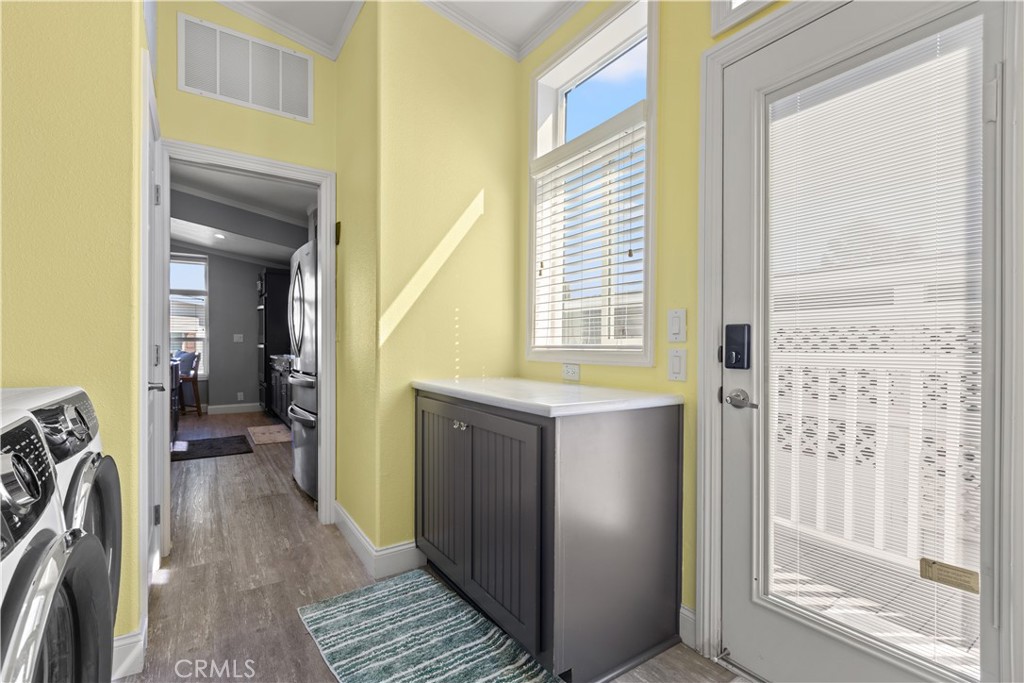 Laundry room w/access to back entrance - 5200 Irvine 58, Irvine CA 92620 - photo 24