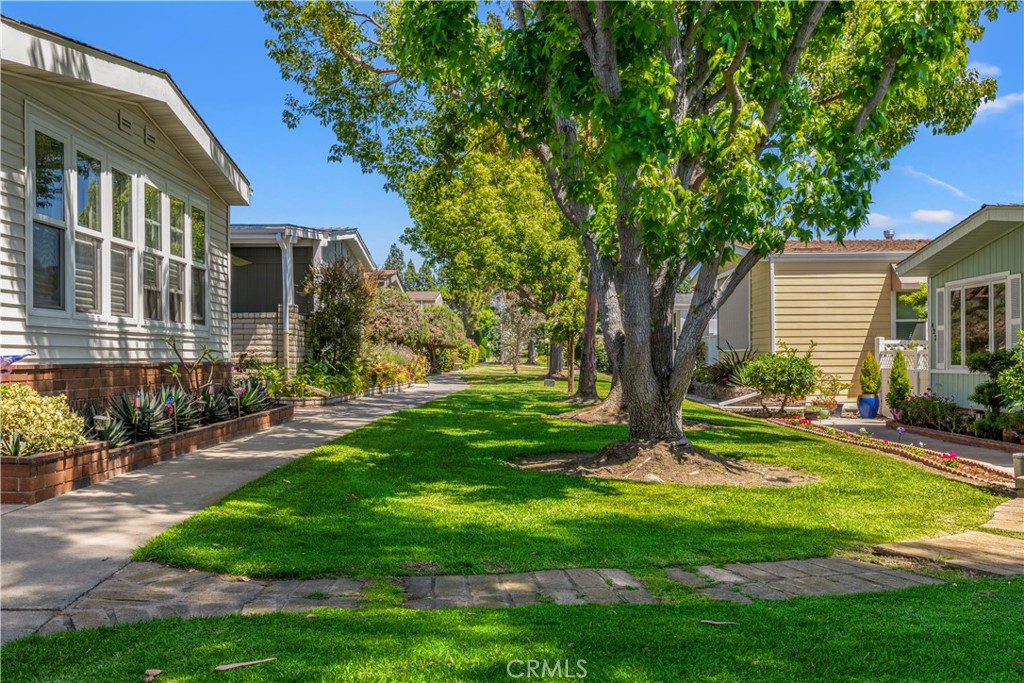 One of many greenbelts with sidewalks - 5200 Irvine Boulevard 179, Irvine CA 92620 - photo 36