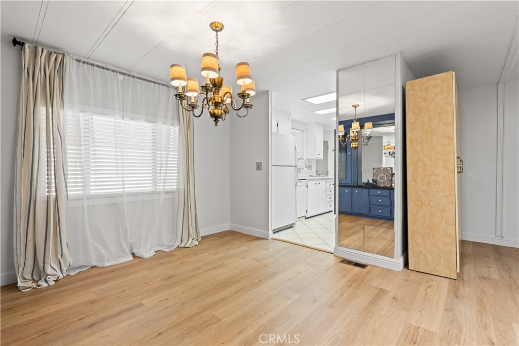 Dining with view of kitchen entry - 5200 Irvine Boulevard 254, Irvine CA 92620 - photo 10