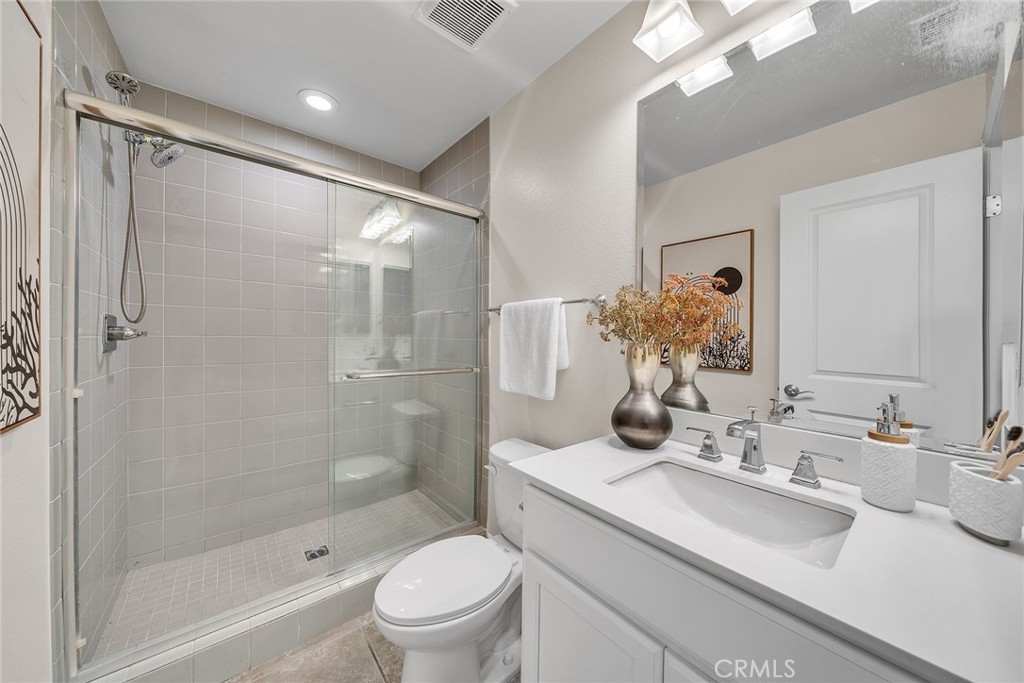 The lower-level bathroom is equipped with a walk-in shower. - 60 Sherwood, Irvine CA 92620 - photo 55