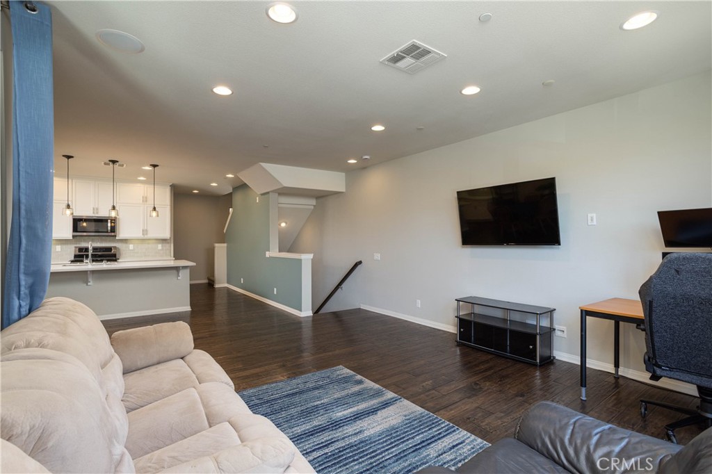 family room looking at entry stairs - 63 Origin, Irvine CA 92618 - photo 9