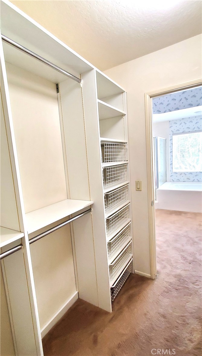 Primary Suite walk in closet with built in organizer - 7 Del Rey 10, Irvine CA 92612 - photo 43