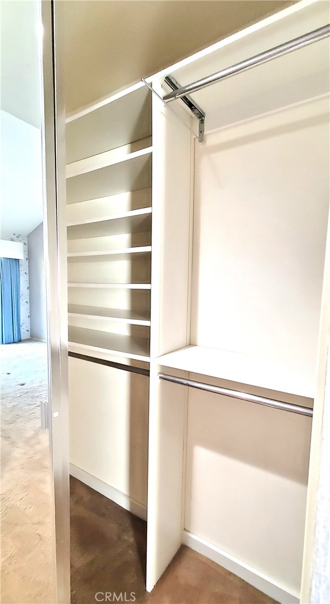Primary Suite 2nd closet with mirror and organizer - 7 Del Rey 10, Irvine CA 92612 - photo 44