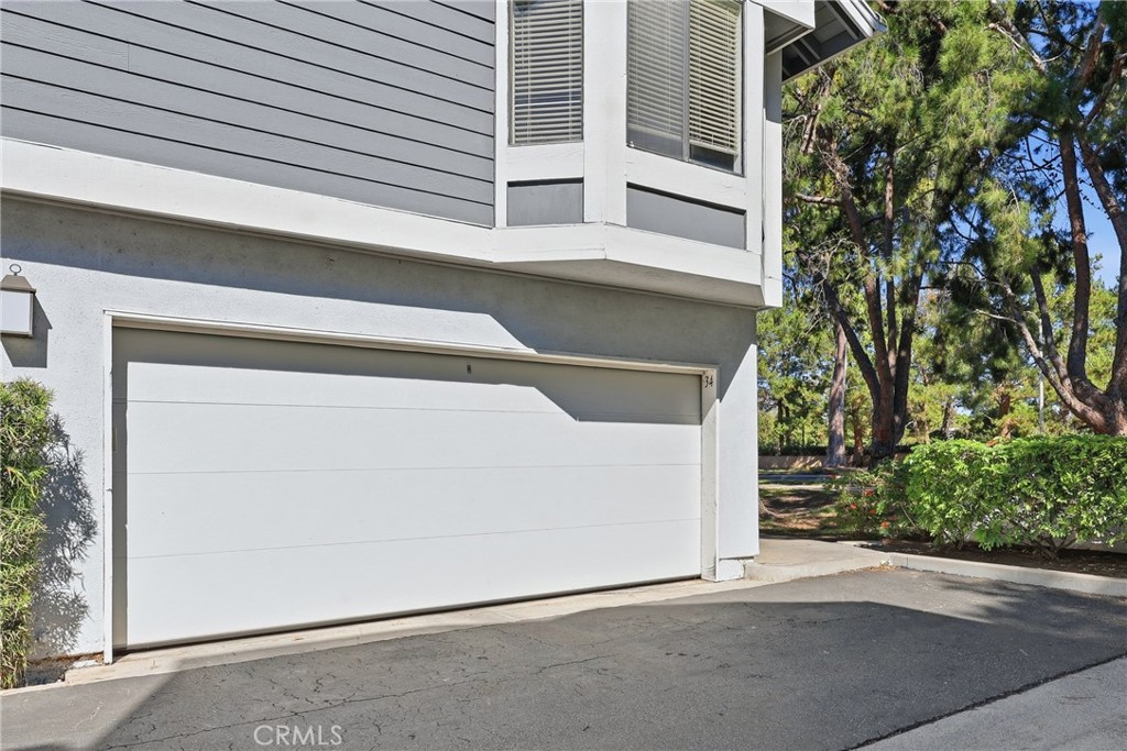 Single car garage is shared with neighbor unit - 70 Remington, Irvine CA 92620 - photo 23