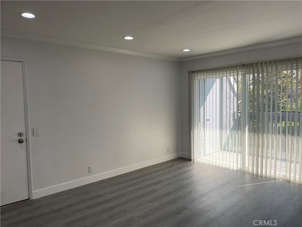 Living room with recessed lights and vynyl plank floring - 79 Wildwood, Irvine CA 92604 - photo 9