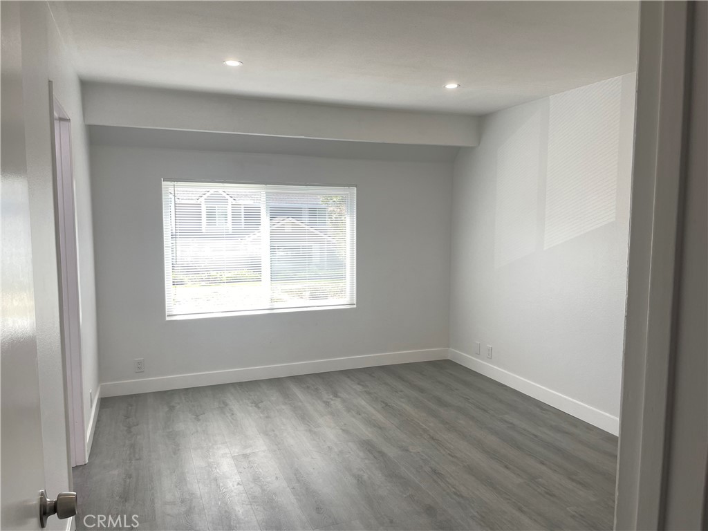 Main bedroom with vinyl flooring and brand new windows with double paned glass - 79 Wildwood, Irvine CA 92604 - photo 19