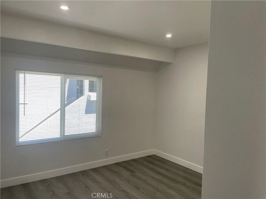 bedroom with vinyl flooring for easy cleaning - 79 Wildwood, Irvine CA 92604 - photo 22