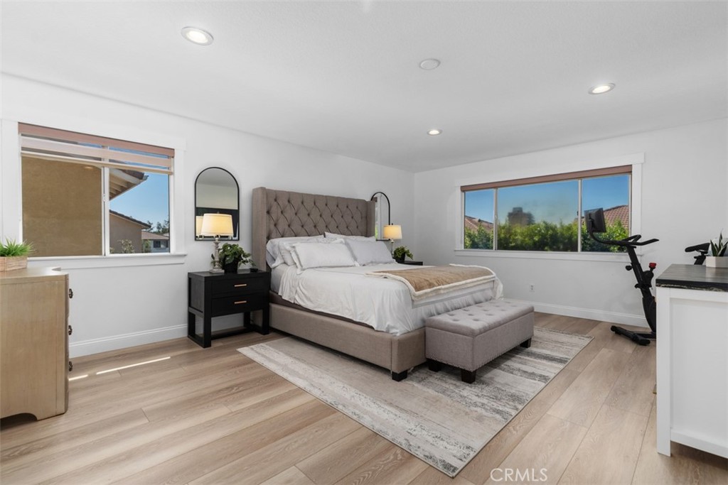 Upstairs primary suite/1 of 4 upstairs bedrooms - 8 National Place, Irvine CA 92602 - photo 26