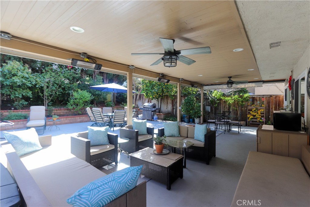 Inviting covered lounge area that feels like an extension of the home—ideal for relaxing, entertaining, and everyday liv - 8 Sandpiper, Irvine CA 92604 - photo 1