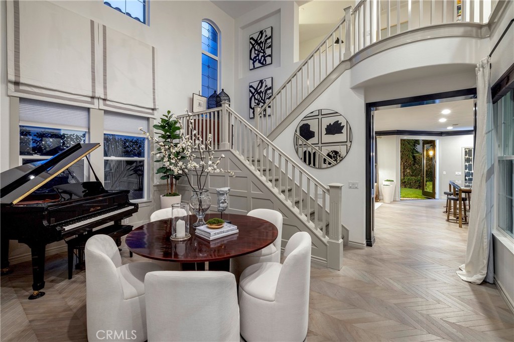 Experience the heart of the home in the soaring 20’ Great Room, with double French doors leading to a covered California - 8 Upland, Irvine CA 92602 - photo 1