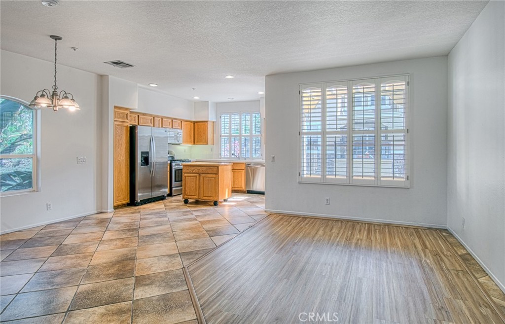 From entryway, living area, dining area and kitchen. - 808 Terra Bella, Irvine CA 92602 - photo 3