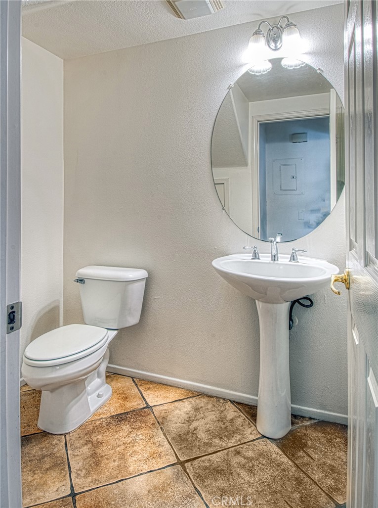 Half bathroom located on main floor. - 808 Terra Bella, Irvine CA 92602 - photo 9