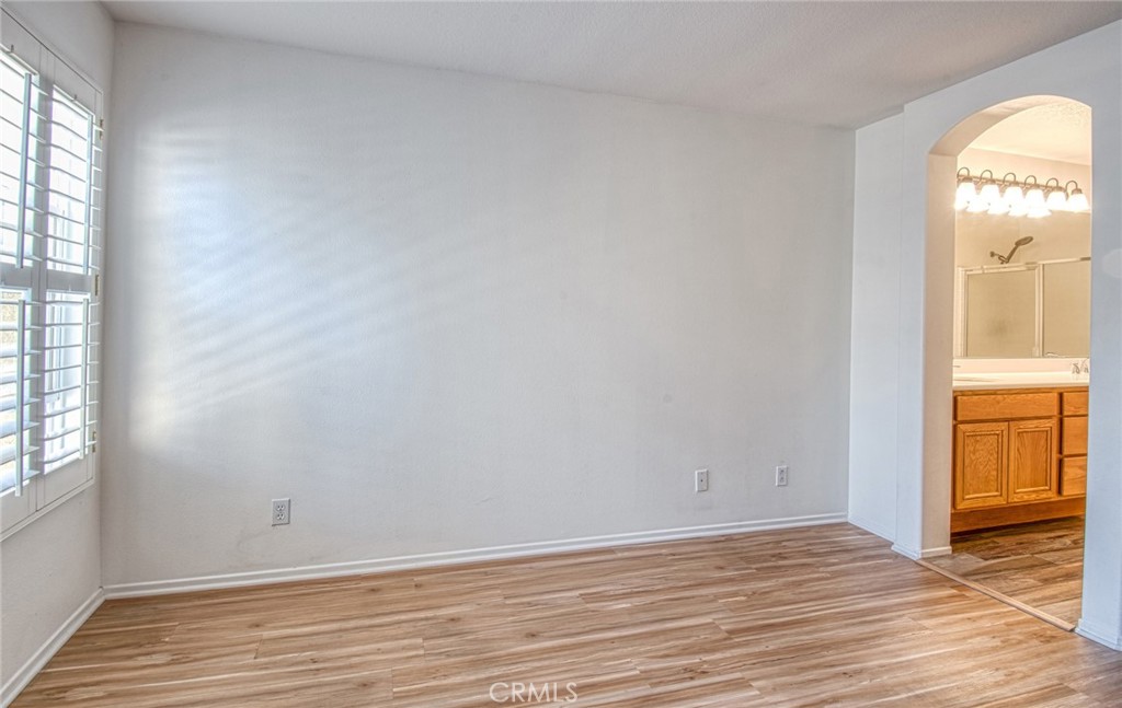 Primary bedroom opens to primary bathroom. - 808 Terra Bella, Irvine CA 92602 - photo 11