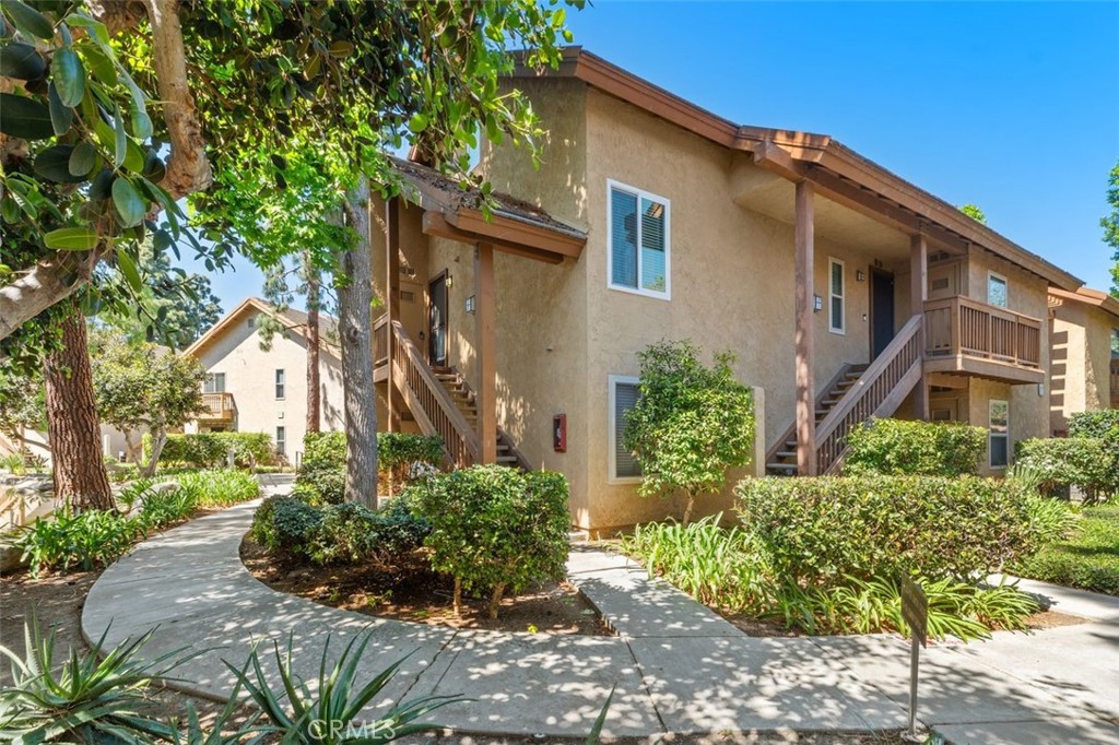 Desirable end unit location! Surrounded by trees and water...and ducklings! - 89 Lemon Grove, Irvine CA 92618 - photo 1