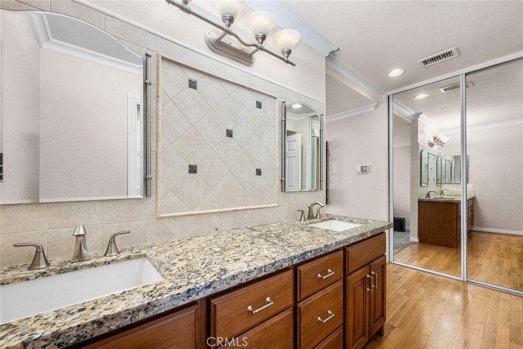 Primary bathroom with double vanity. - 9 Badger Pass, Irvine CA 92604 - photo 12