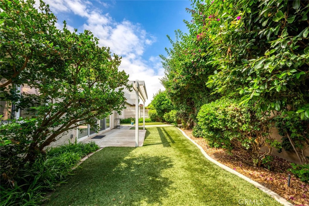 Turfed yard for easy maintenance. - 9 Badger Pass, Irvine CA 92604 - photo 24