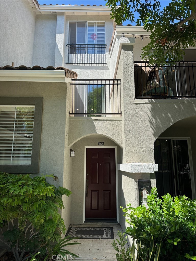 Tri-level one bedroom townhome with attached garage. - 902 Maplewood, Irvine CA 92618 - photo 1