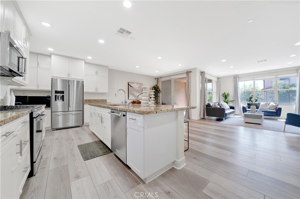 Kitchen Open to Living & Dining Room - 92 Capricorn, Irvine CA 92618 - photo 5