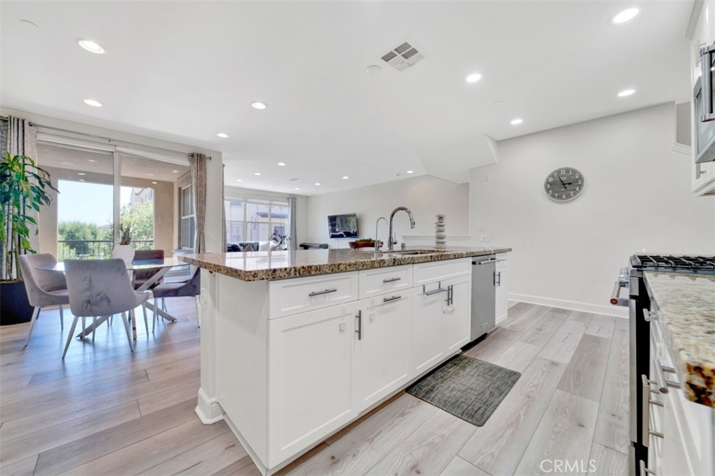 Kitchen Open to Living & Dining Room - 92 Capricorn, Irvine CA 92618 - photo 13