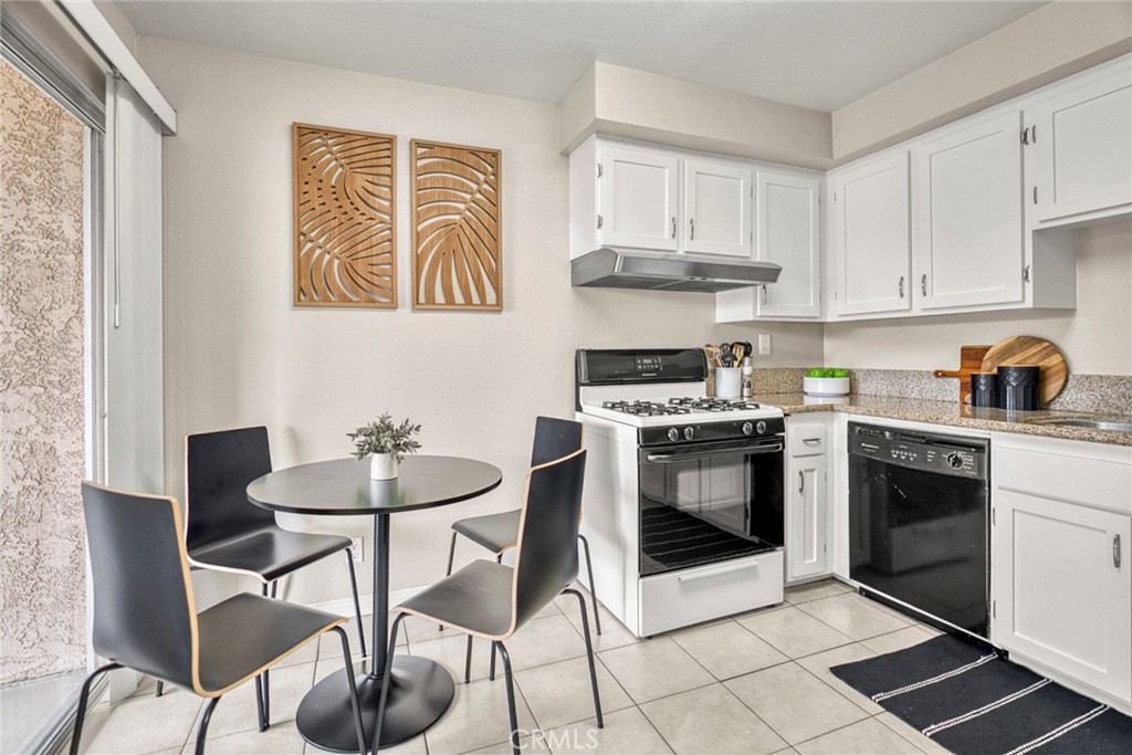 The kitchen offers ample workspace and room for a cozy breakfast nook, while the open floor plan creates a seamless conn - 1064 Las Lomas Drive D, La Habra CA 90631 - photo 10