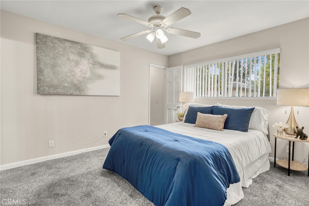 The primary bedroom offers a relaxing retreat, providing a comfortable and inviting space to unwind at the end of the da - 1064 Las Lomas Drive D, La Habra CA 90631 - photo 13