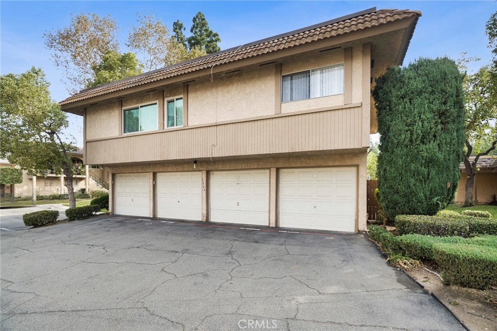 Parking is a welcome bonus, with a private garage located directly beneath the home and equipped with remote access, plu - 1064 Las Lomas Drive D, La Habra CA 90631 - photo 18
