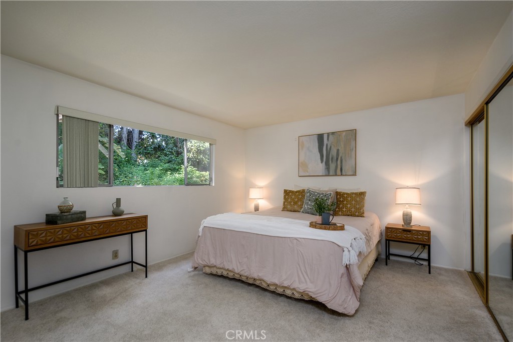 Downstairs bedroom with a good sized closets and attached bathroom - 1301 Ironwood Street, La Habra CA 90631 - photo 9