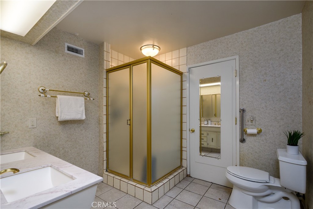 Downstairs three-quarter bathroom with exit to the exterior - 1301 Ironwood Street, La Habra CA 90631 - photo 12