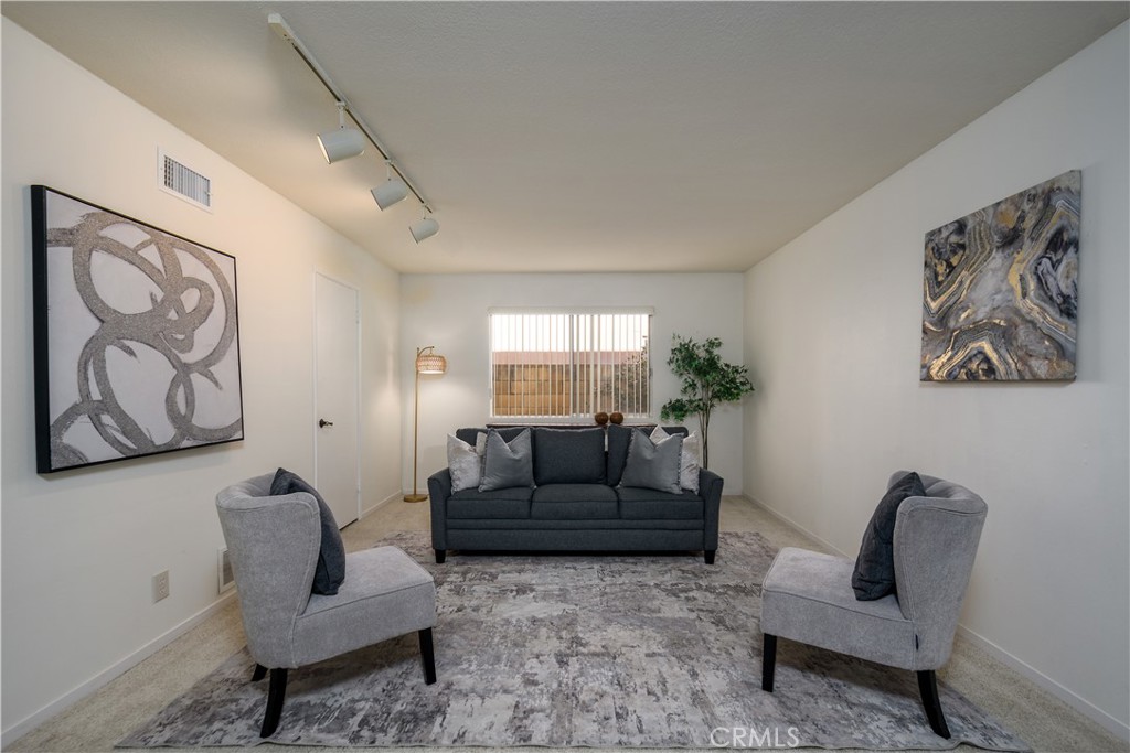 A versitile room downstairs.. could be a 5th bedroom, den, office with a door to the attached 2-car garage - 1301 Ironwood Street, La Habra CA 90631 - photo 14