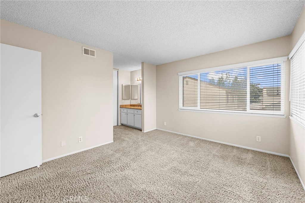 Primary Bedroom with much natural light - 1401 Cheltenham Lane, La Habra CA 90631 - photo 16