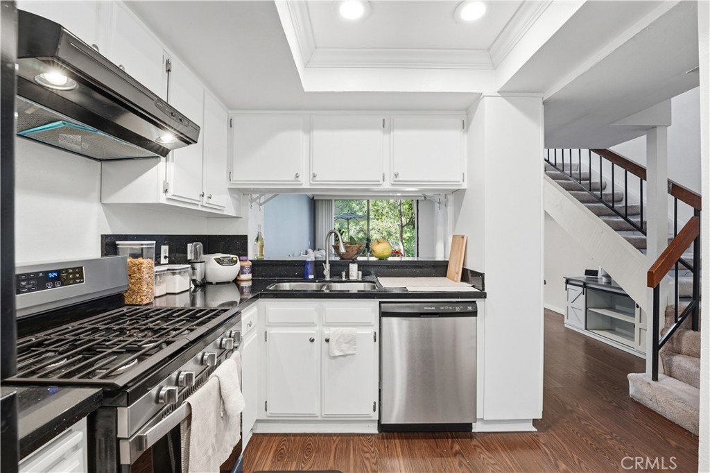 Kitchen that looks out to living room and private landscaping - 1655 W Lambert G, La Habra CA 90631 - photo 1